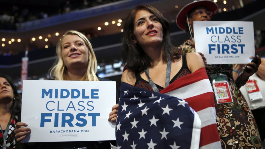 In this Sept. 5, 2012 at the Democratic National Convention in Charlotte, N.C. democratic supporters hold up signs showing their concern for the middle class. Image: AP