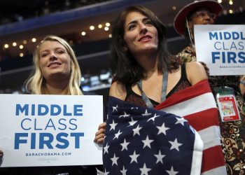 In this Sept. 5, 2012 at the Democratic National Convention in Charlotte, N.C. democratic supporters hold up signs showing their concern for the middle class. Image: AP