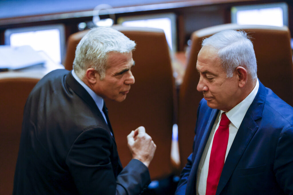 Yair Lapid and Benjamin Netanyahu. Image: Olivier Fitoussi/Flash90