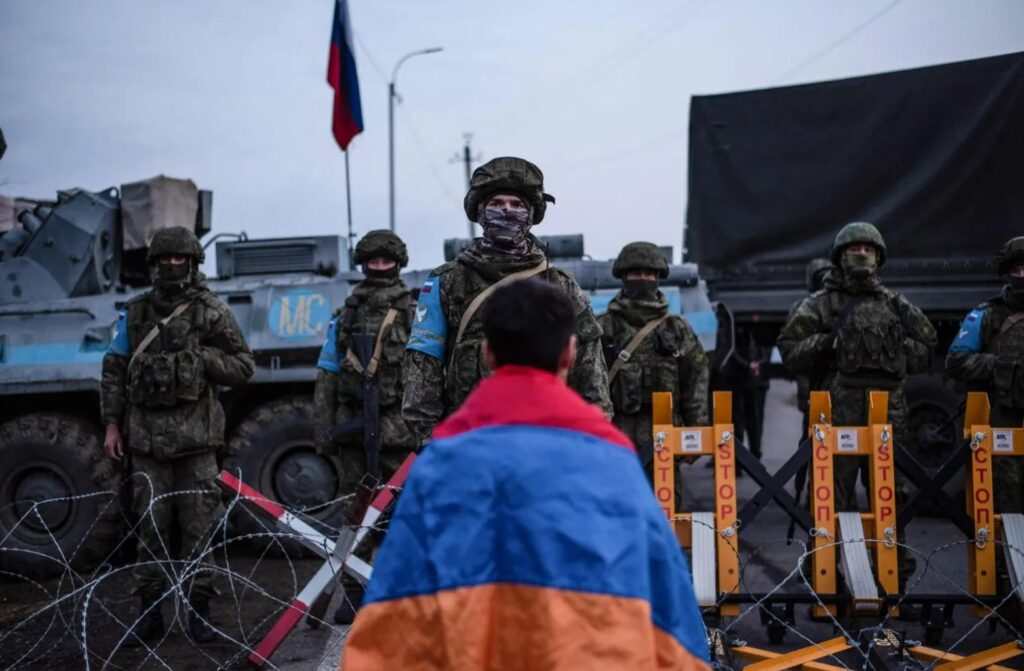 An opponent of the blockade at the checkpoint of Russian peacekeepers near Stepanakert. Image: AP