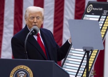US President Donald Trump holds up a chart while speaking during a trade announcement event in the Rose Garden at the White House on April 2, 2025, in Washington, D.C.