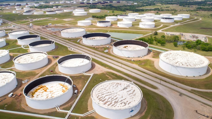 Oil prices stay firm despite forecasts of global surplus